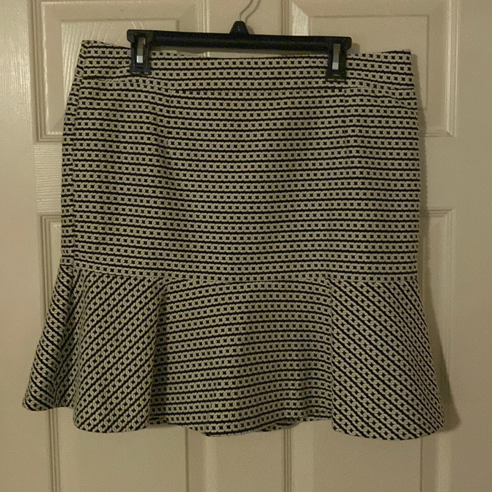 Knee length skirt with black lining. Very beautiful.